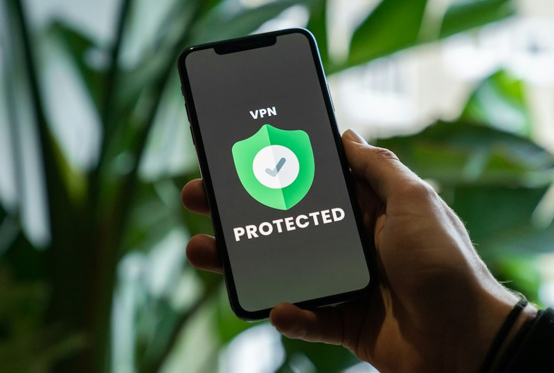 Person holding black phone